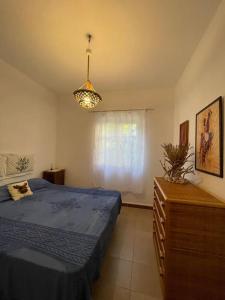 Ένα ή περισσότερα κρεβάτια σε δωμάτιο στο Le Tre Ghinee