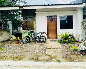 a motorcycle parked in front of a house at BnB in Kabankalan