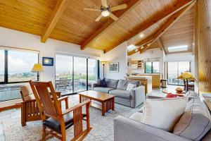a living room with a couch and a table at Blue Heron in Sea Ranch