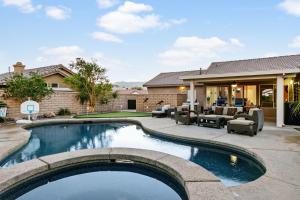 a swimming pool in the backyard of a house at Quiet & Quite Perfect in Palm Desert