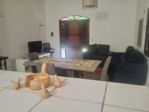 a living room with a cat figurines on a table at Tabuleiro Beach in Aquiraz