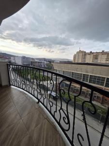 a balcony with a view of a city at Nido Verde in Gjilan