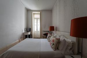 Postel nebo postele na pokoji v ubytování GuestReady - Charming House Marquês