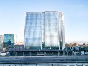 a large building with many windows in a city at Radisson Hotel Istanbul Merter in Istanbul