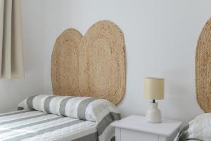 Łóżko lub łóżka w pokoju w obiekcie Apartamento Perez Zara 7