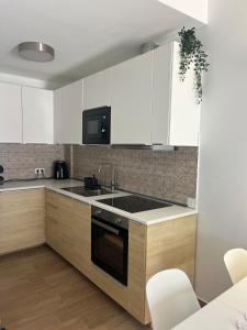 Una cocina o cocineta en Apt Flora