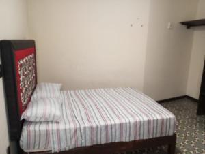 Postel nebo postele na pokoji v ubytování Hotel China Poblana