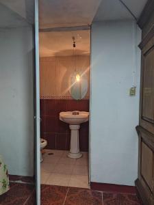 a bathroom with a sink and a toilet at Hostal puebla in San Baltasar