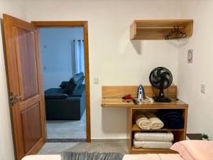 a room with a bed and a table with towels at Casa Paini in Pomerode +26 photos