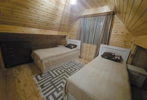A bed or beds in a room at Sabauri
