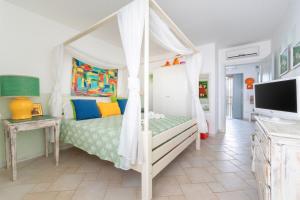 a bedroom with a bed with a canopy at Le Terrazze in Otranto