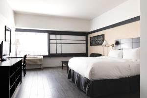 Ліжко або ліжка в номері Hotel Ruby Foo's