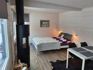 Postel nebo postele na pokoji v ubytování Im Land der Lappen Villa Pakatti