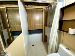 a small bathroom with a toilet and a sink at Dowtown lofts by flor y tierra in Guadalajara +35 photos