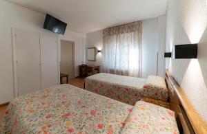 Postel nebo postele na pokoji v ubytování Hotel Pedro Torres
