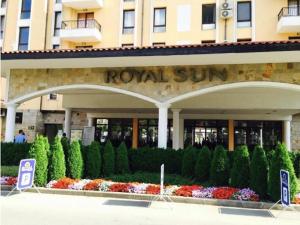 a building with a royal sun sign in front of it at Apartment at Royal Sun, Sunny Beach in Sunny Beach