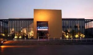 a building with a casino sign in front of it at La Suite Design Dunkerque Plage à 50 mTerrasse Sud in Dunkerque +14 photos