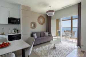 a living room with a couch and a table at Intempo Sea View by Leo Apartments in Benidorm