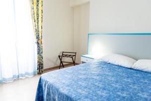 Letto o letti in una camera di HC Pineto