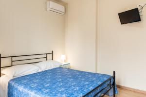 Letto o letti in una camera di HC Pineto