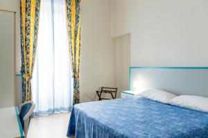 Letto o letti in una camera di HC Pineto