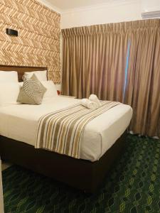 Katil atau katil-katil dalam bilik di Dwengu Guest house