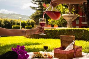 a person is pouring a glass of wine at Fiesta Americana Hacienda Ixtapan de La Sal in Ixtapan de la Sal