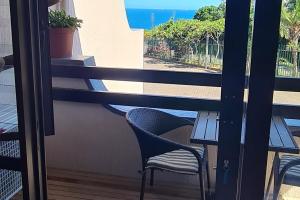 En balkon eller terrasse på African surf explosion! tasteful upmarket unit
