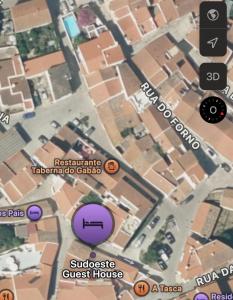 a map of a street with a purple circle at Sudoeste Guest House in Odeceixe