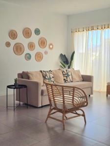 a living room with a couch and a chair at Casa Bela in Mindelo