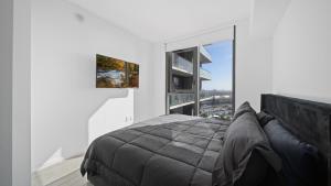 a bedroom with a large bed and a large window at 2-Bedr Downtown Miami Condo Bay Views in Miami