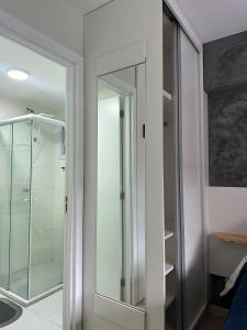 a glass shower in a bathroom with a glass door at Nari Loft in São Paulo +14 photos
