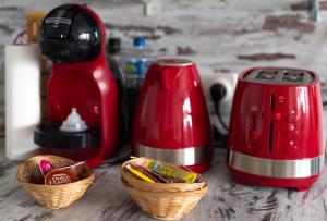 a red toaster and two baskets of food on a counter at Shoumy in Les Trois-Îlets