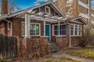 an old brick house with a blue door at Chic Denver Family Retreat Free Parking & Prime Location in Denver +36 photos
