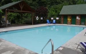 a large swimming pool with a gazebo at Wanderlust in Sevierville