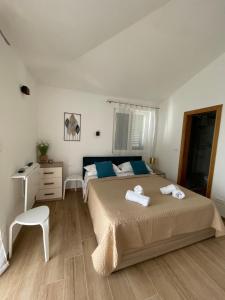 Ένα ή περισσότερα κρεβάτια σε δωμάτιο στο Apartments Topić - Promajna