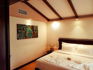 Ένα ή περισσότερα κρεβάτια σε δωμάτιο στο Ziva Suites - A Botique Hotel