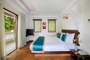 Ένα ή περισσότερα κρεβάτια σε δωμάτιο στο Ziva Suites - A Botique Hotel
