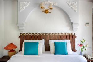 Ένα ή περισσότερα κρεβάτια σε δωμάτιο στο Ziva Suites - A Botique Hotel