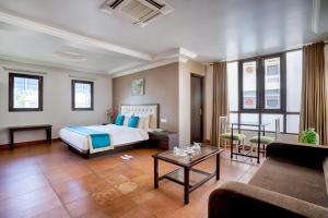 Ένα ή περισσότερα κρεβάτια σε δωμάτιο στο Ziva Suites - A Botique Hotel