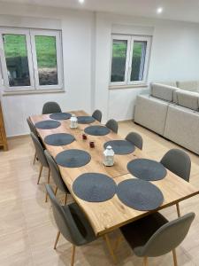 a conference room with a wooden table and chairs at Villa Emilio Foz in Foz