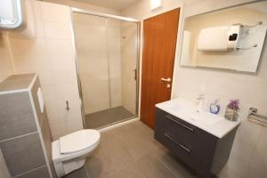 Ein Badezimmer in der Unterkunft Apartment Macan