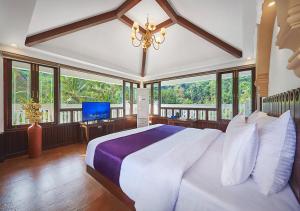 Ένα ή περισσότερα κρεβάτια σε δωμάτιο στο Ziva Suites - A Botique Hotel