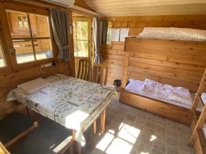 Postel nebo postele na pokoji v ubytování Krogager Primitiv Camping - Krogen
