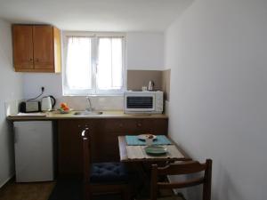A kitchen or kitchenette at Theodosia Studios