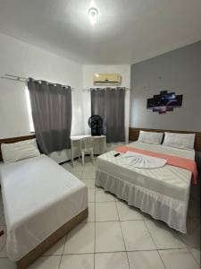 Postel nebo postele na pokoji v ubytování Lua Hotel