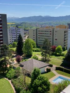 arial view of a city with buildings and a house at Appartement 1,5 pces in Fribourg