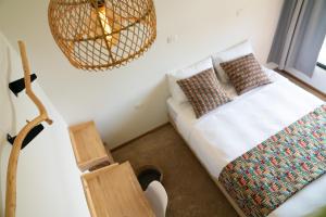 Postel nebo postele na pokoji v ubytování Hotel con Corazon Monteverde