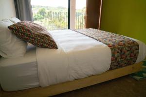 Postel nebo postele na pokoji v ubytování Hotel con Corazon Monteverde