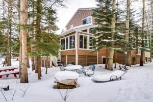 una casa en la nieve con mesas y sillas en Spacious Frisco Retreat with Private Hot Tub!, en Frisco